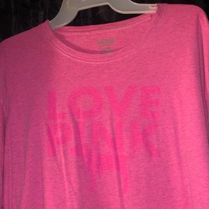 It is a hot pink shirt from the brand pink